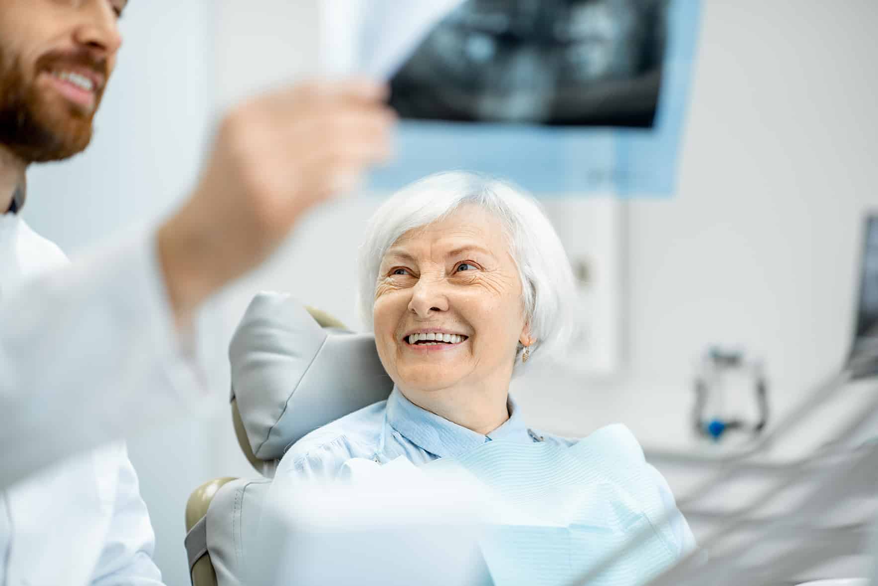 elderly woman with dr kelly during dental appointment at serenity creek dental