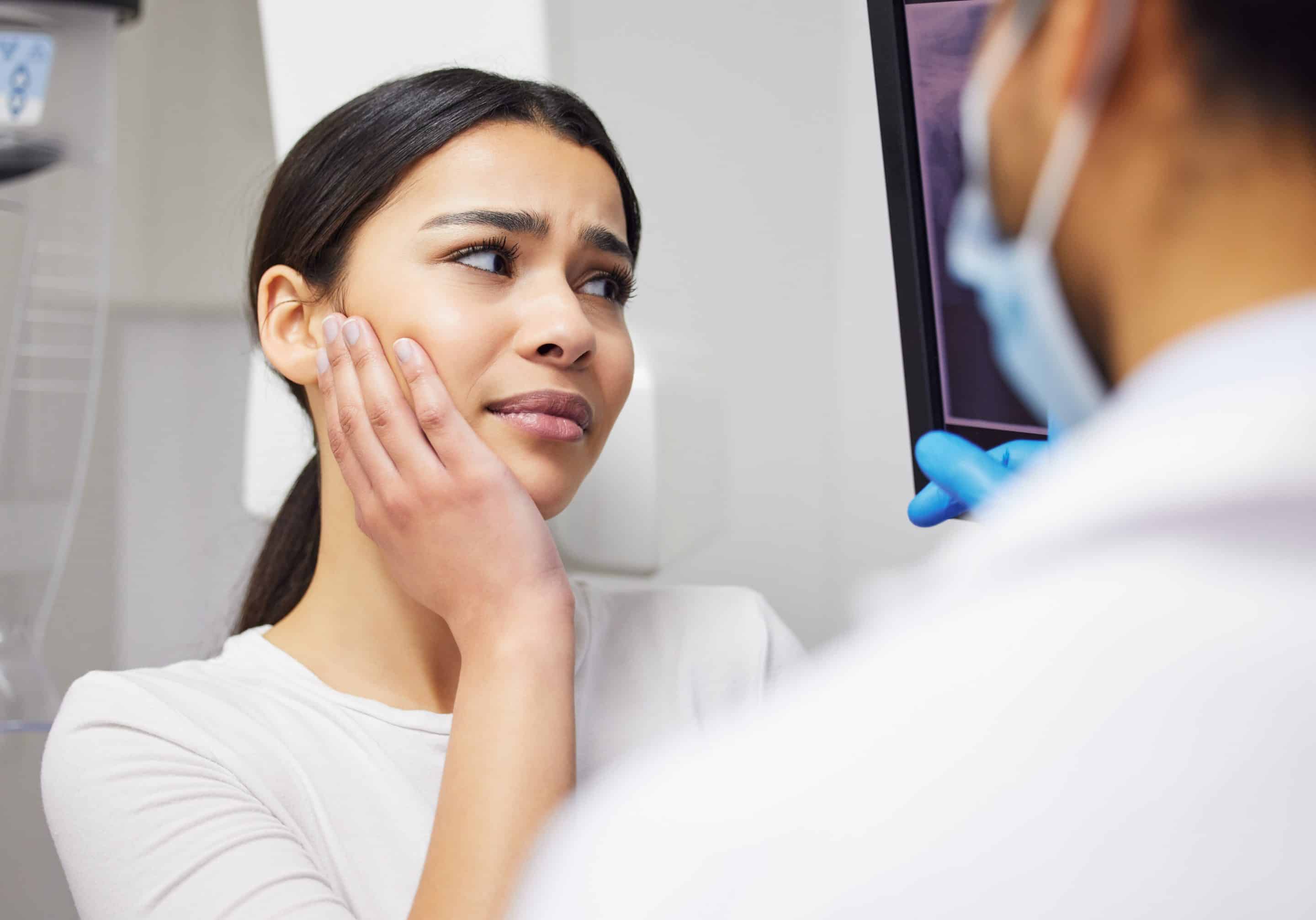 dental patient talking with dr kelly about dental pain in noblesville indiana